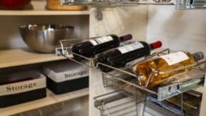 pantry organization featuring wine racks, baskets, shelves, and spice racks
